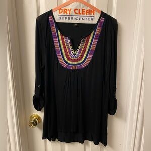 Black v-neck shirt. Long sleeve that can rolled to 3/4 length.